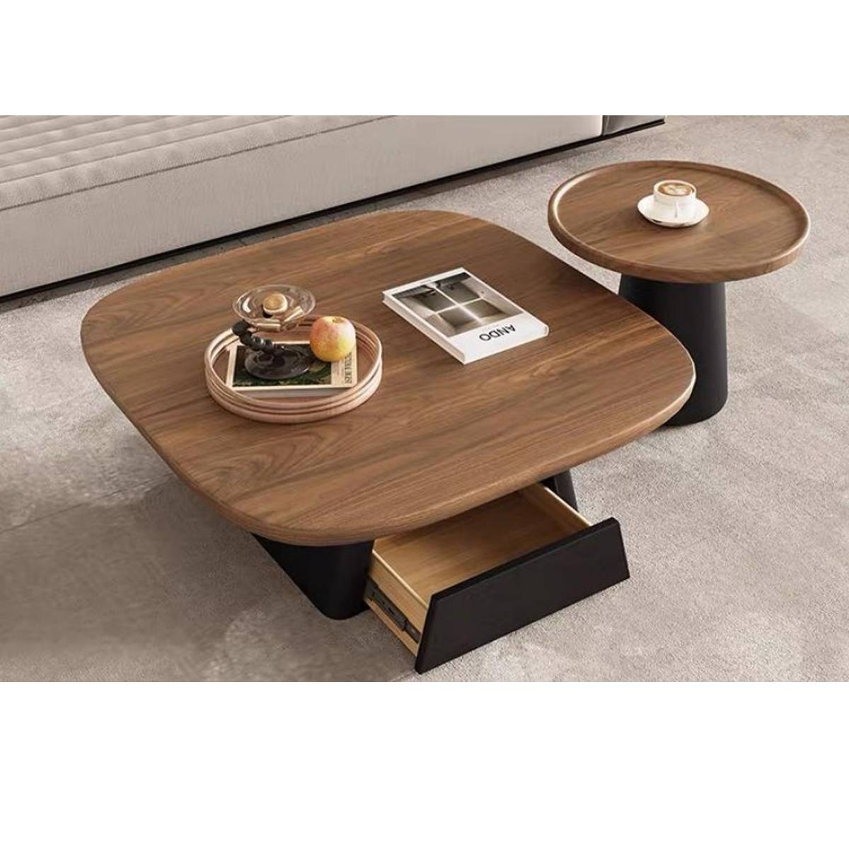 Close-up view of the coffee table set showing the open drawer and wood grain texture