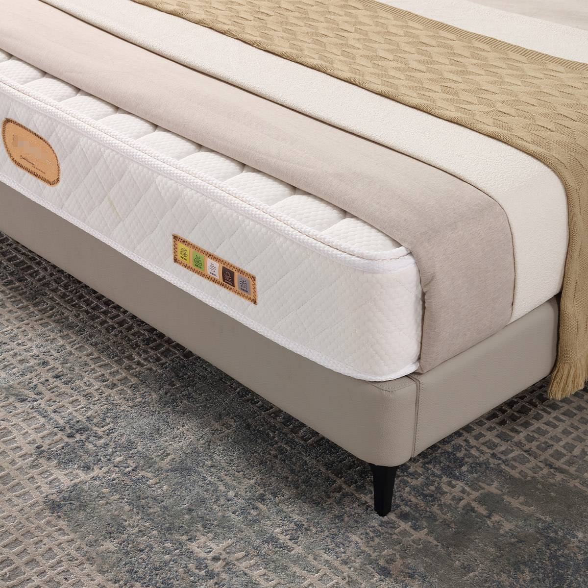 Close-up of the mattress and bed frame corner showing the slat base