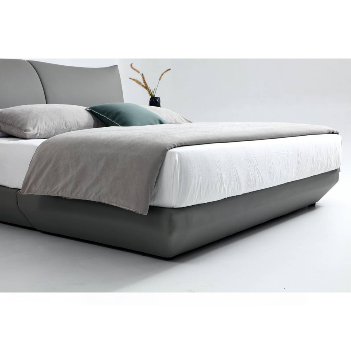 Side angle view of the bed showing the mattress and base structure