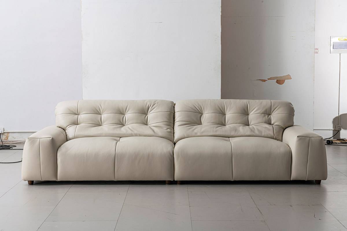 Close-up detail of the sofa's tufted backrest and armrest design