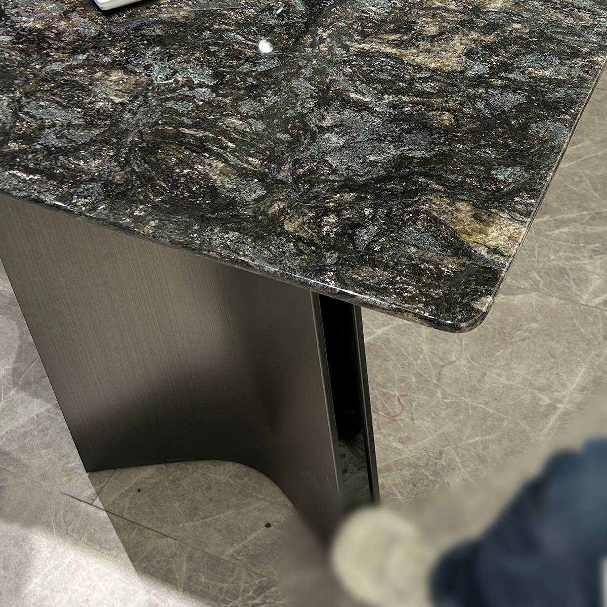 Close-up of the stainless steel base and stone connection