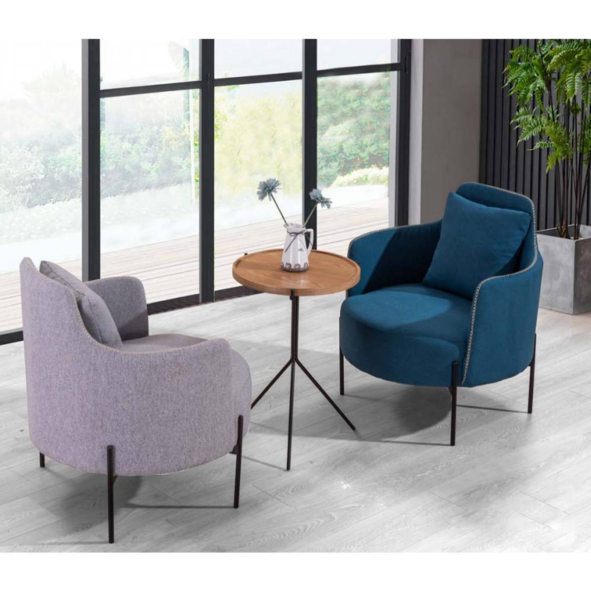 Lifestyle shot of blue and grey lounge chairs with a side table