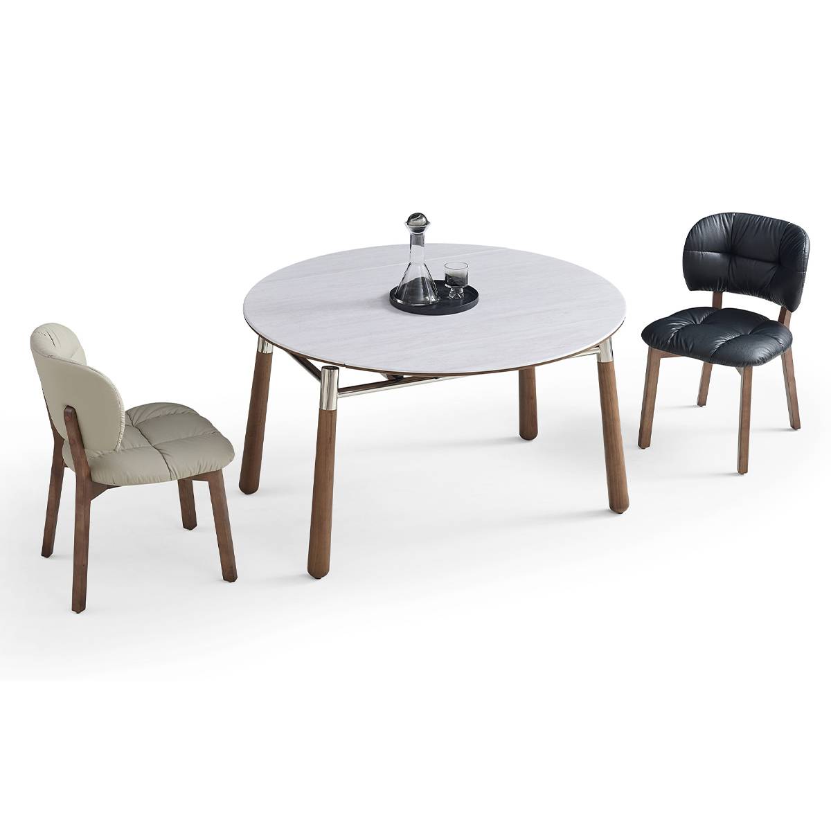 Lifestyle shot of the compact round table accompanied by two dining chairs.
