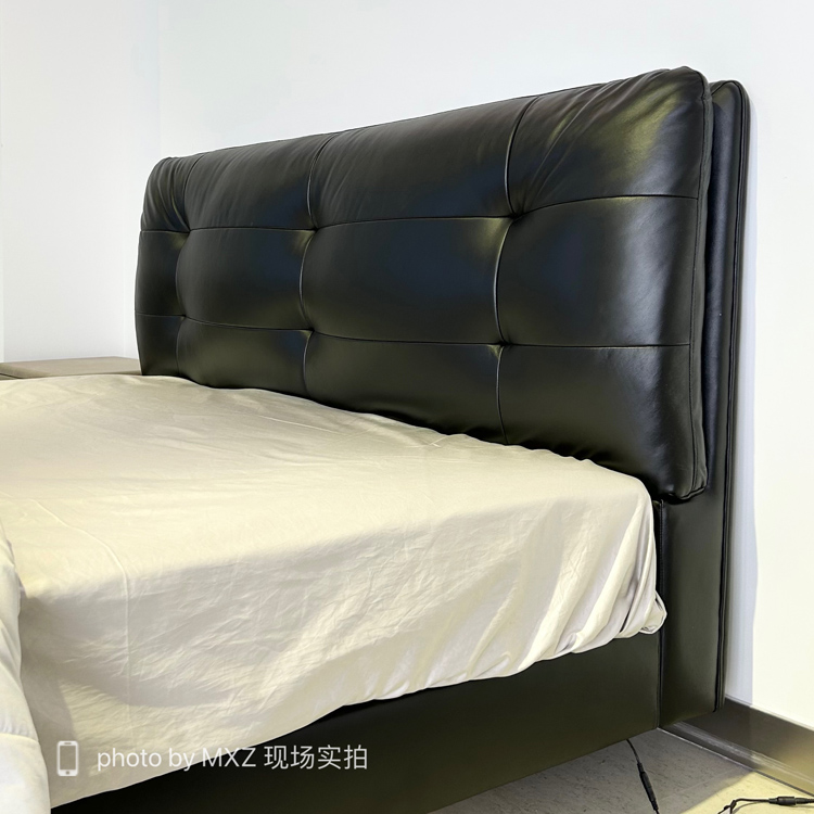 Side view of the bed frame showing the headboard and mattress