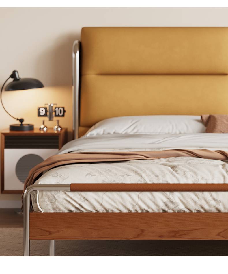 Detail of the bed frame corner showing the stainless steel leg and wooden structure