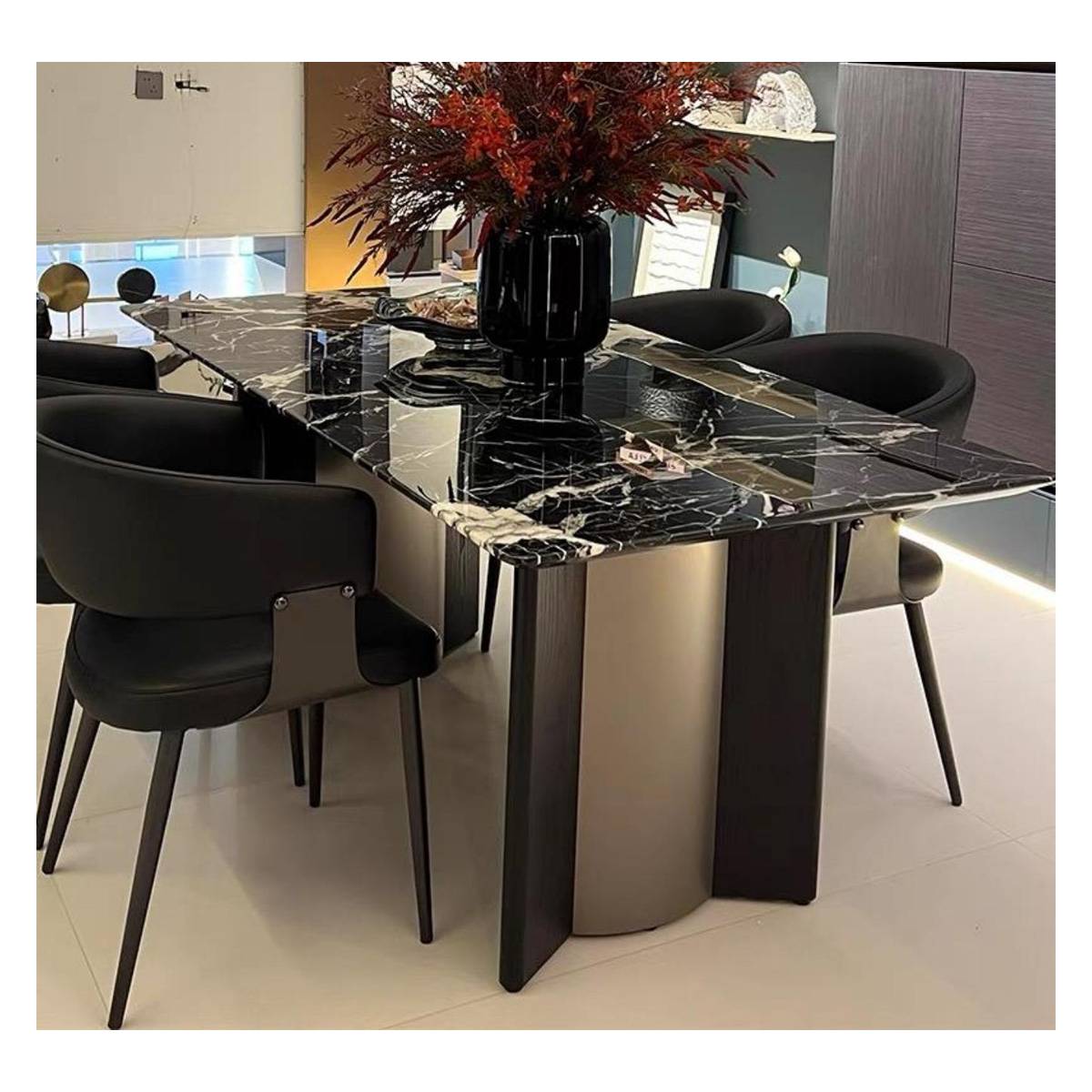 Close-up of the dining table base and marble top with black chairs