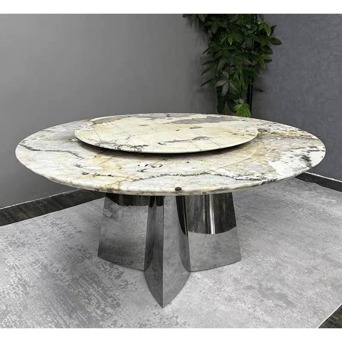 Front view of the round Pandora marble dining table with turntable
