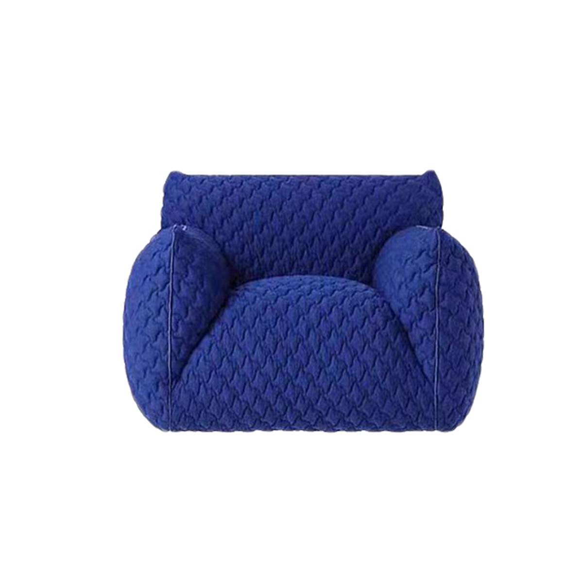 Front view of the blue quilted lounge chair