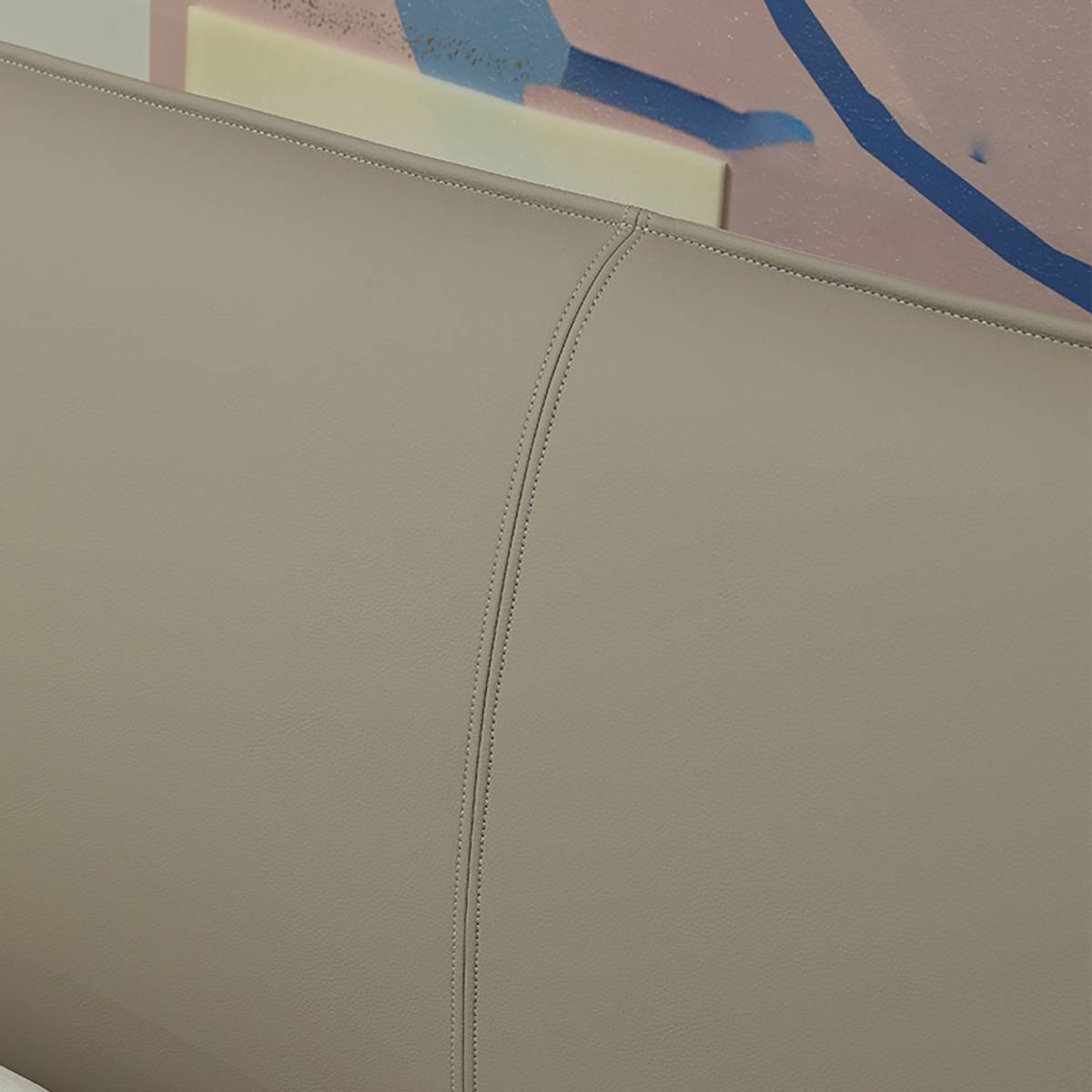 Close-up detail of the headboard stitching and leather texture