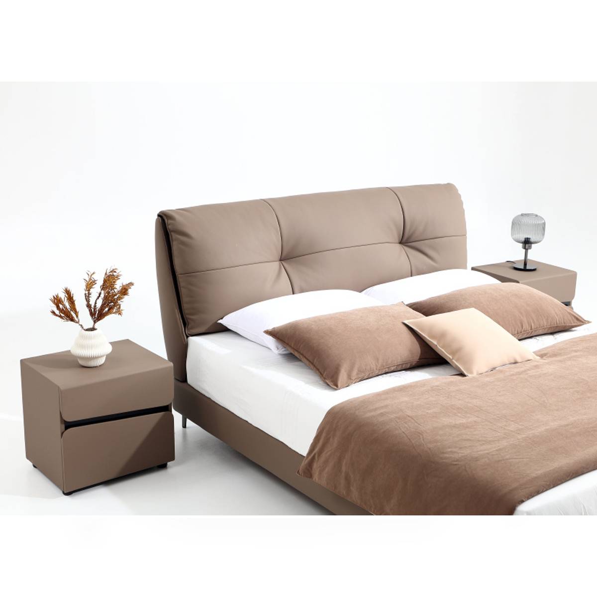 Close-up view of the bed headboard and pillows showing the leather texture