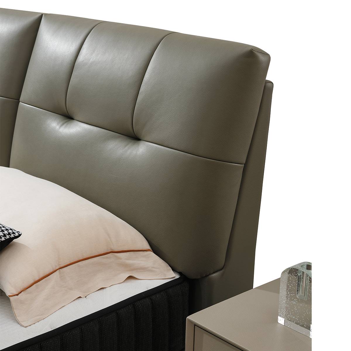 Detail shot of the tufted leather headboard texture