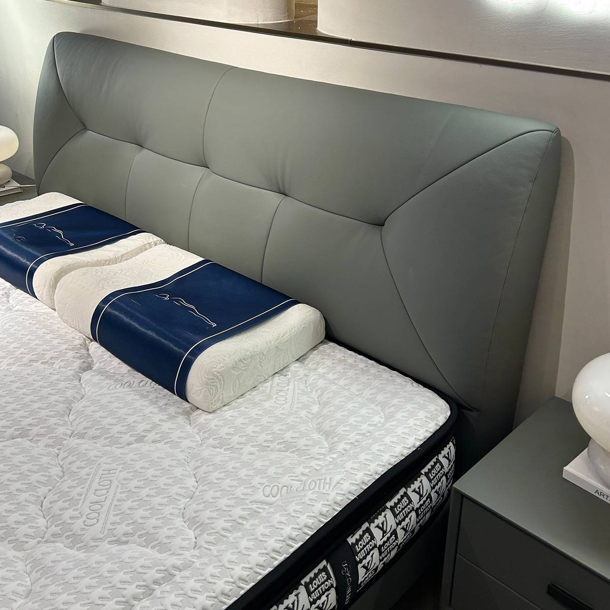 Close-up of the tufted leather headboard and mattress