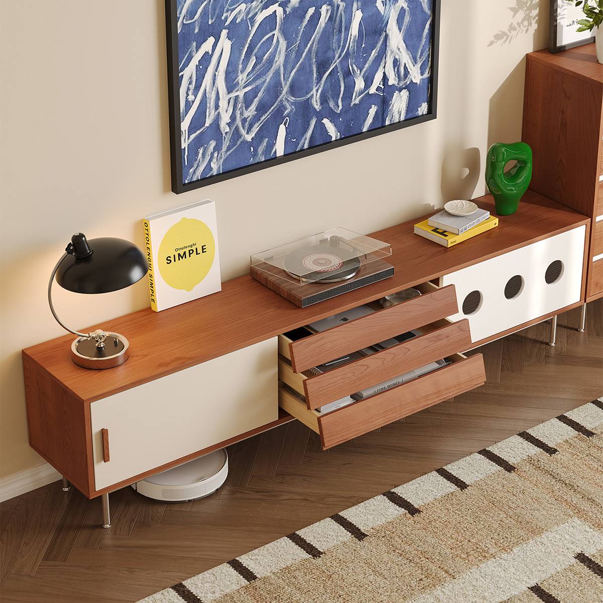 Close-up of TV console drawers open showing storage capacity