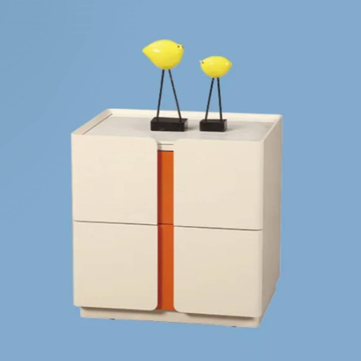 Bedside cabinet with yellow bird figurines on top against blue background