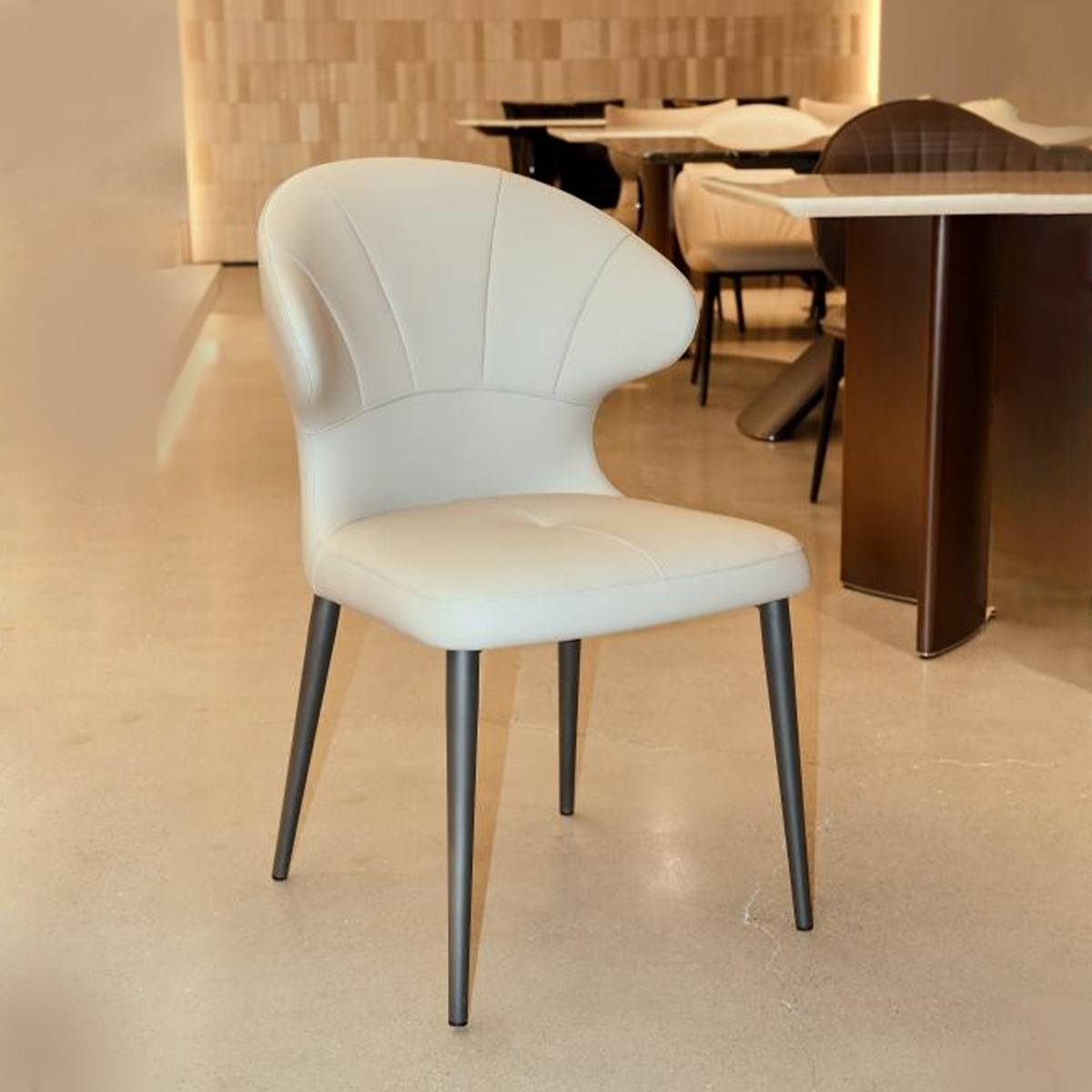 Beige modern dining chair in a dining room setting