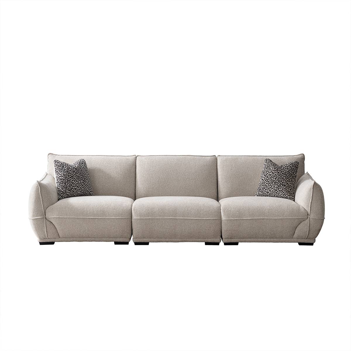 Front view of a beige fabric sofa with patterned throw pillows