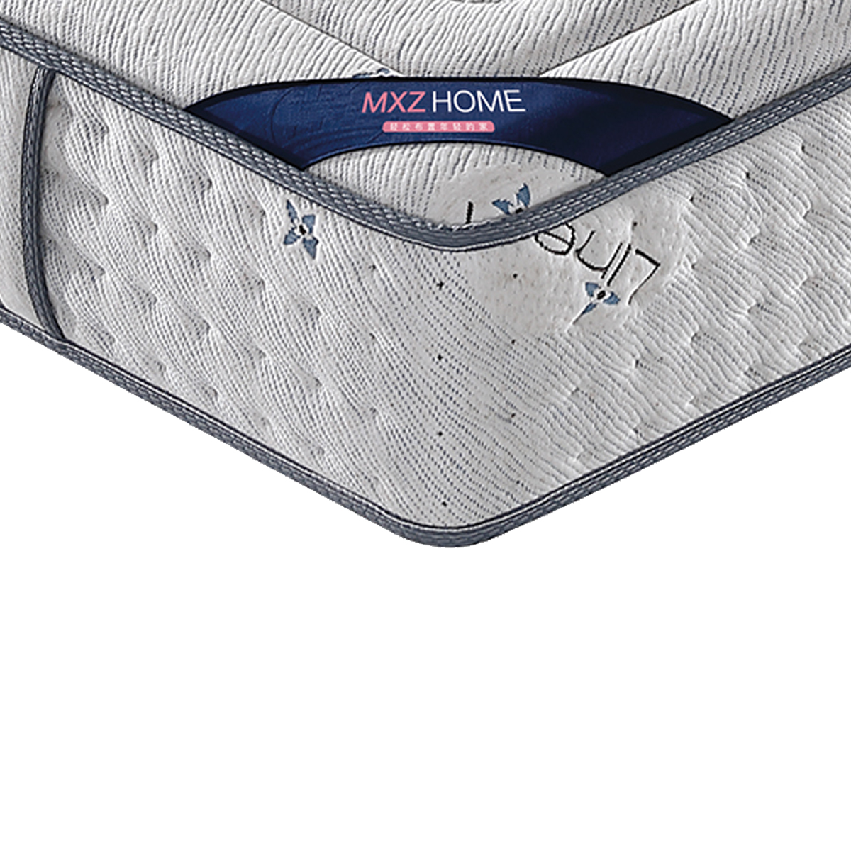 Corner detail of the mattress featuring the MXZ HOME brand label