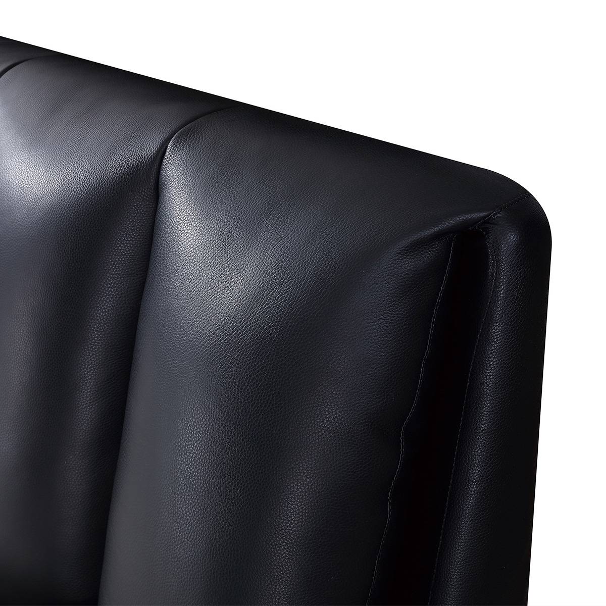 Close-up detail of the black leather texture and stitching on the headboard