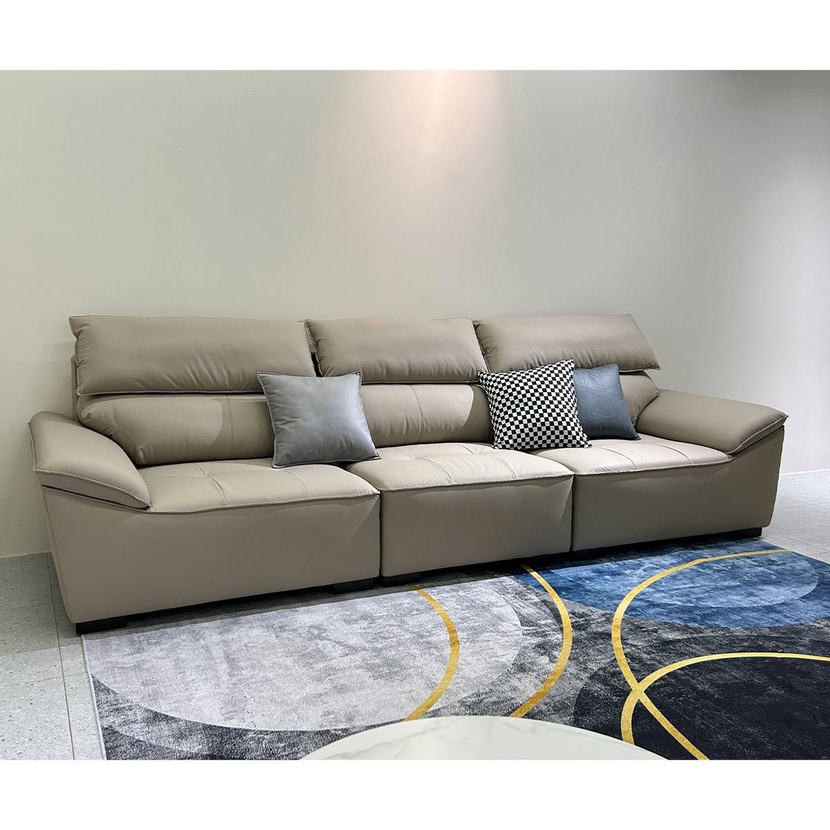 Front view of the beige sofa with decorative throw pillows