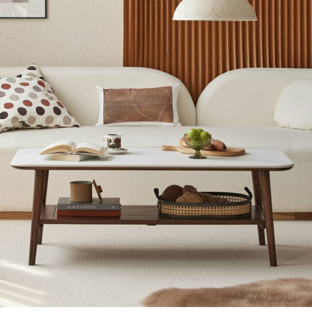 Front view of the Santa Rosa coffee table showing the lower shelf and items on top