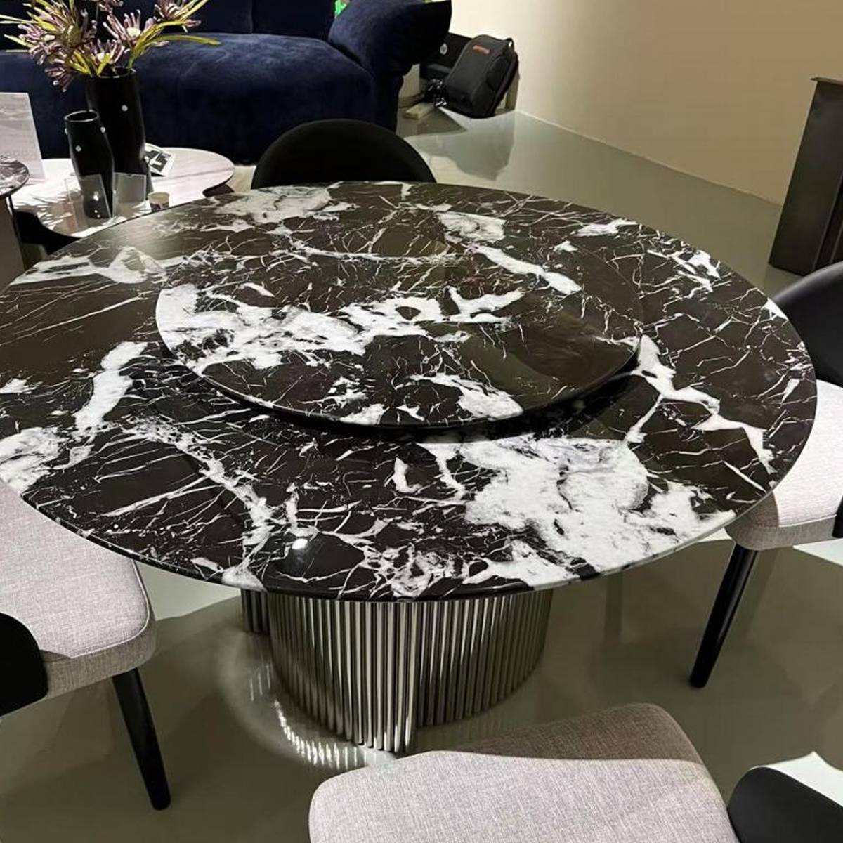 Close-up view of the black and white marble tabletop and turntable