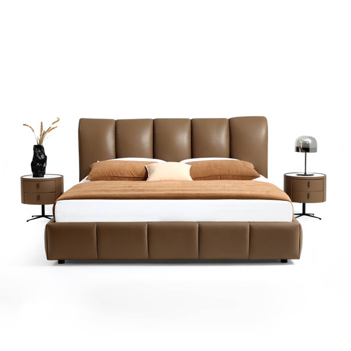 Front view of the brown leather bed showing the tufted headboard and base