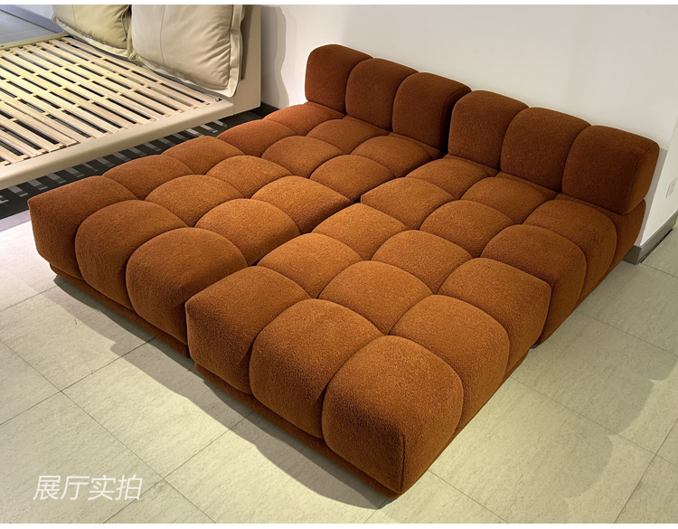 Full view of the L-shaped modular sofa in a showroom setting
