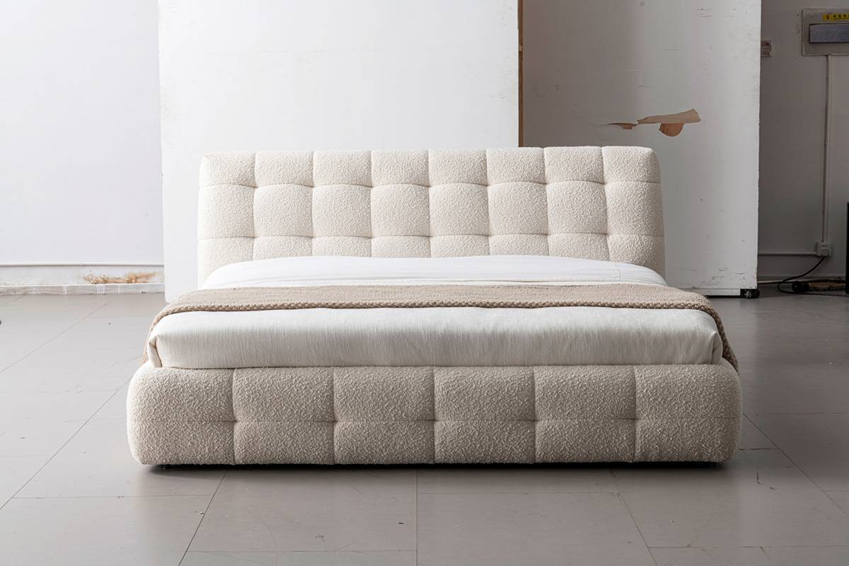 Front view of the bed highlighting the tufted headboard and base design
