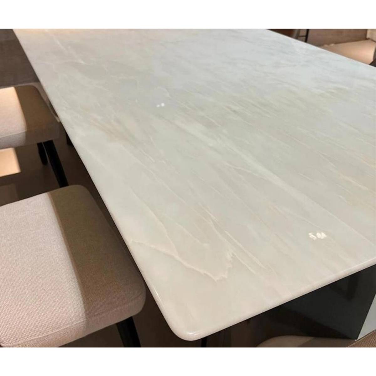 Close-up detail of the white marble table surface showing natural veining