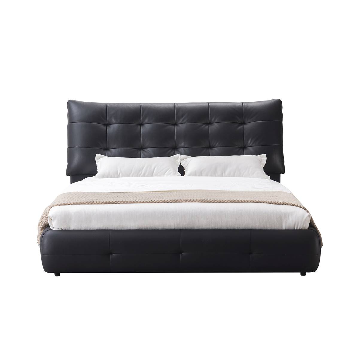 Front view of the black leather bed with white bedding and beige throw