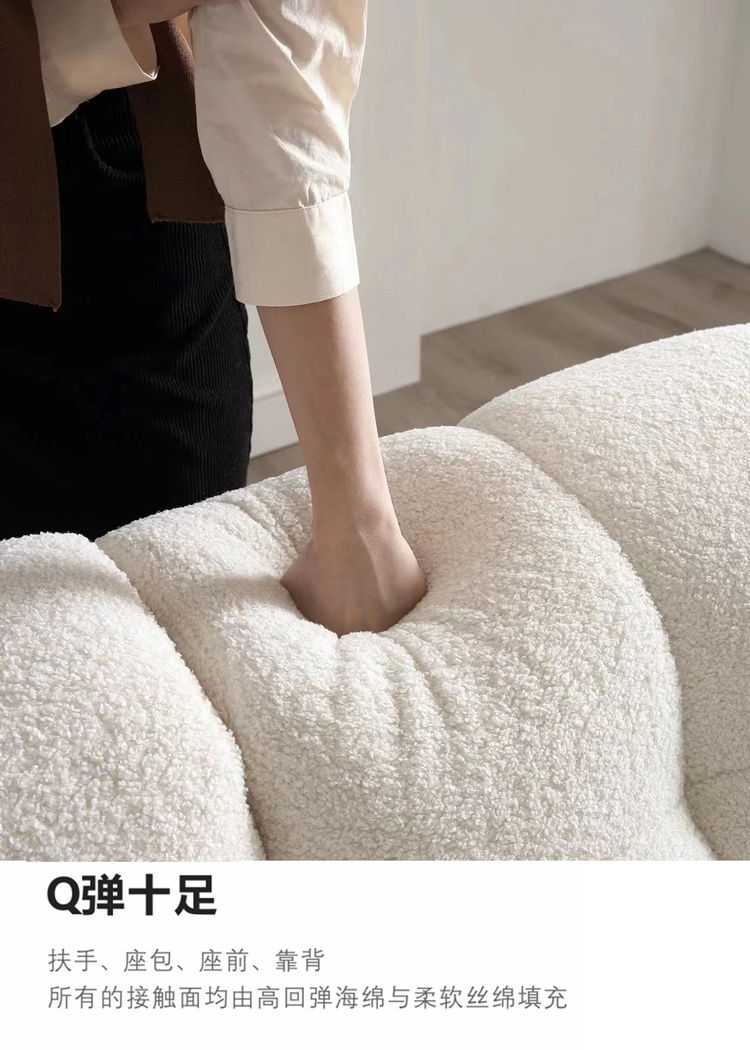 Hand pressing into the sofa cushion to demonstrate high resilience and bounce