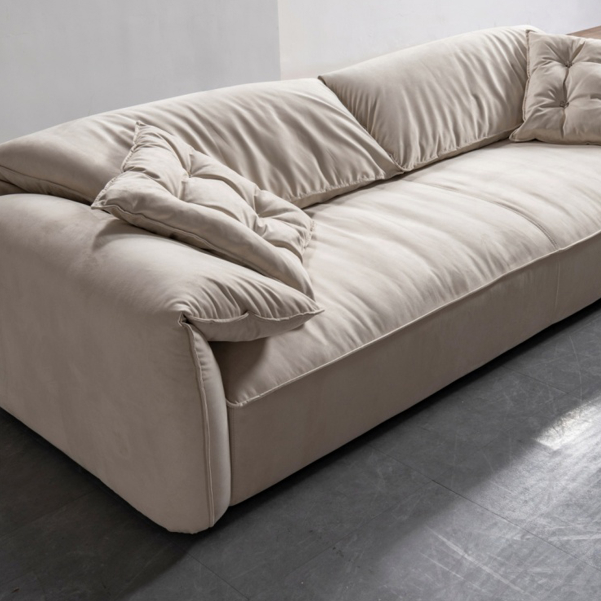 Full view of the sofa on a grey tiled floor