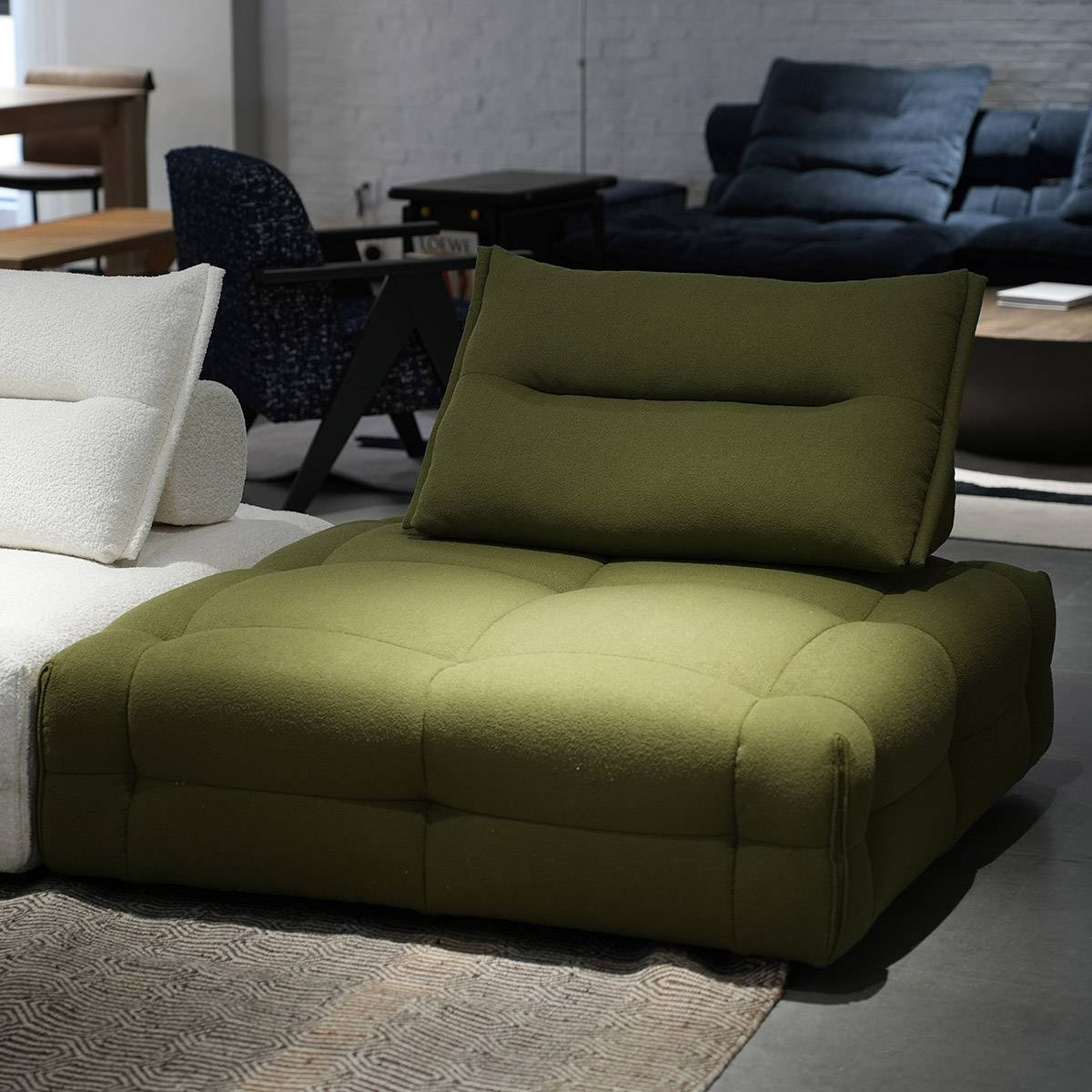 Side angle view of green lounge chair