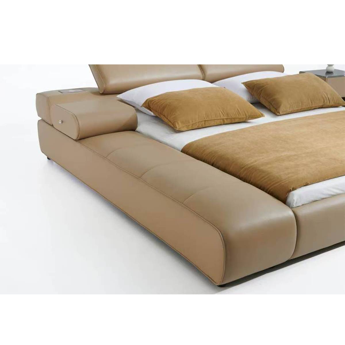Close-up detail of the chaise lounge armrest and leather stitching