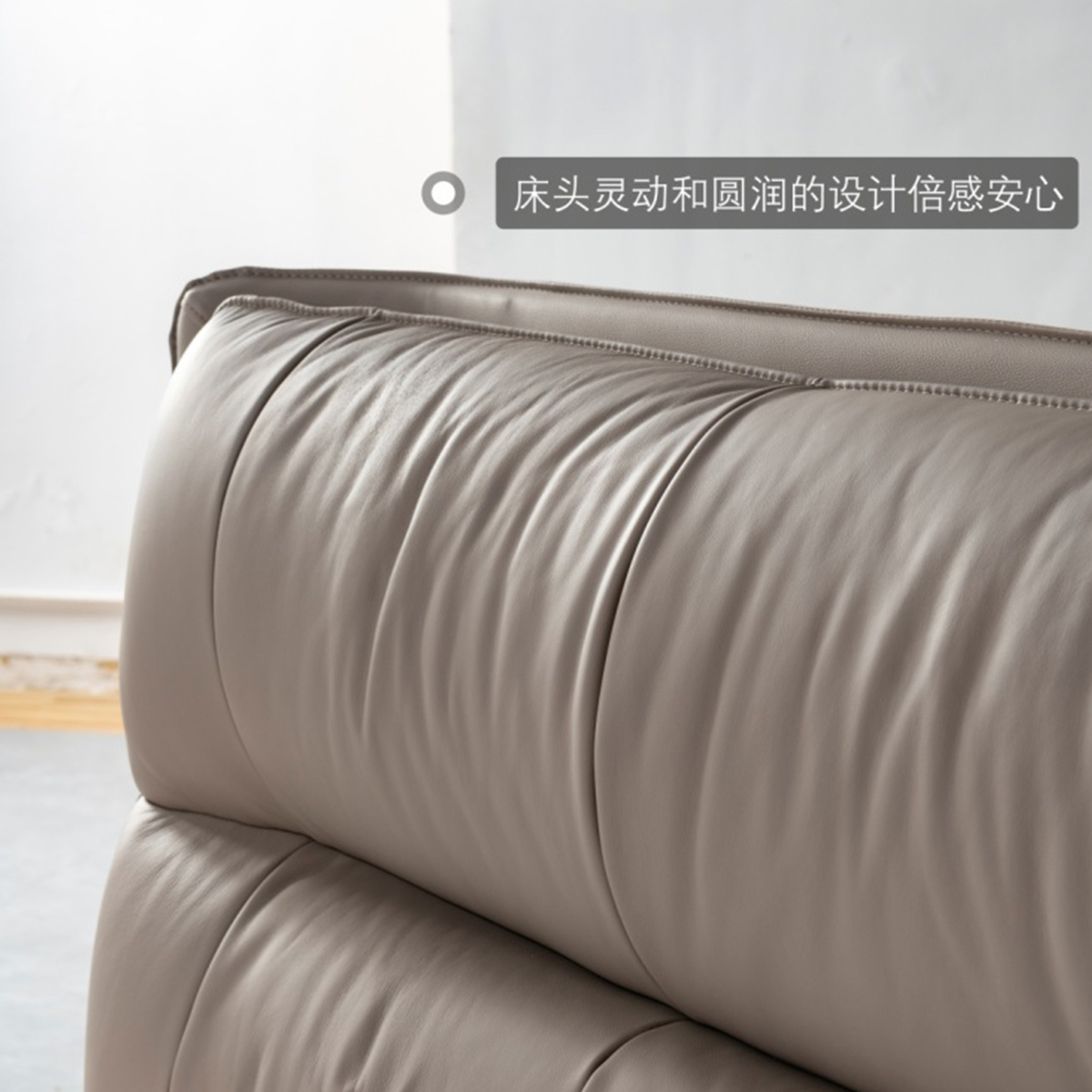 Close-up of the tufted, rounded top edge of the headboard