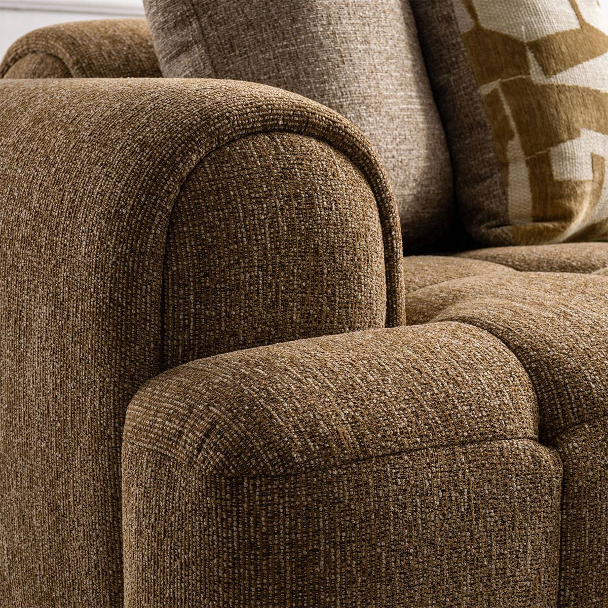 Close-up detail of the fabric texture and rolled armrest