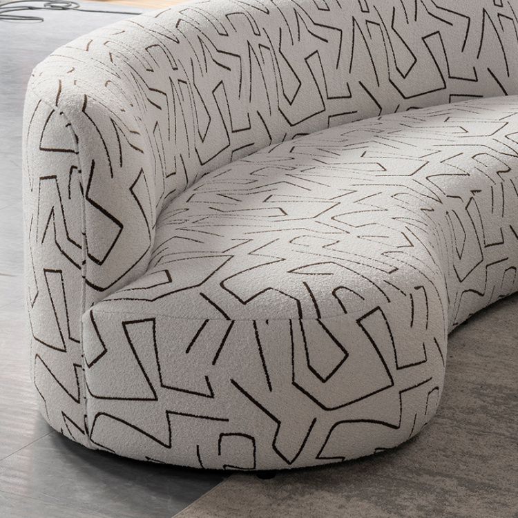 Side view of the curved sofa seat and backrest highlighting the fabric pattern.
