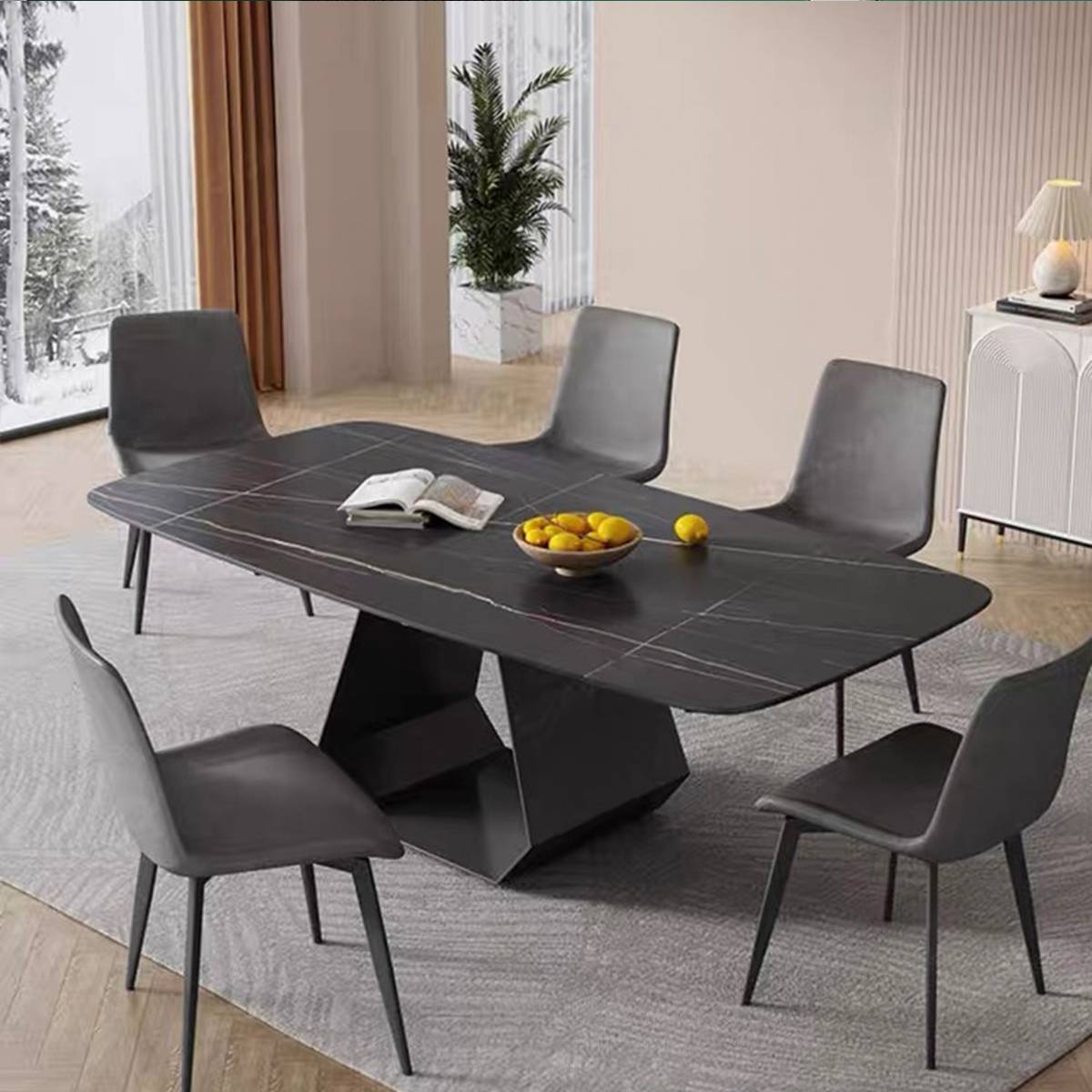 Black sintered stone dining table with grey chairs