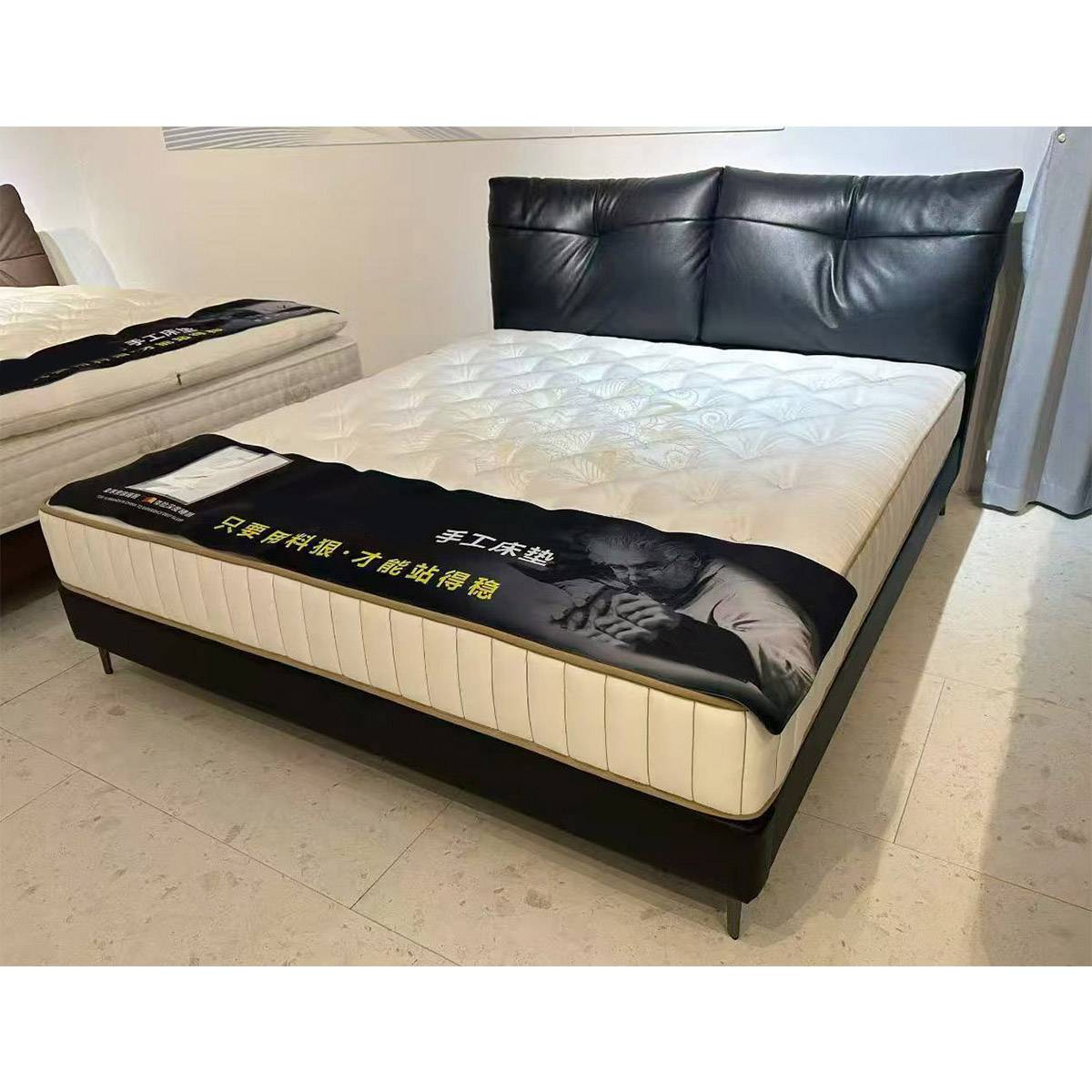Bed frame with mattress and promotional banner