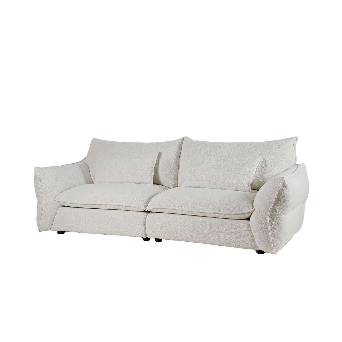 Three-quarter view of the white fabric sofa against a white background.