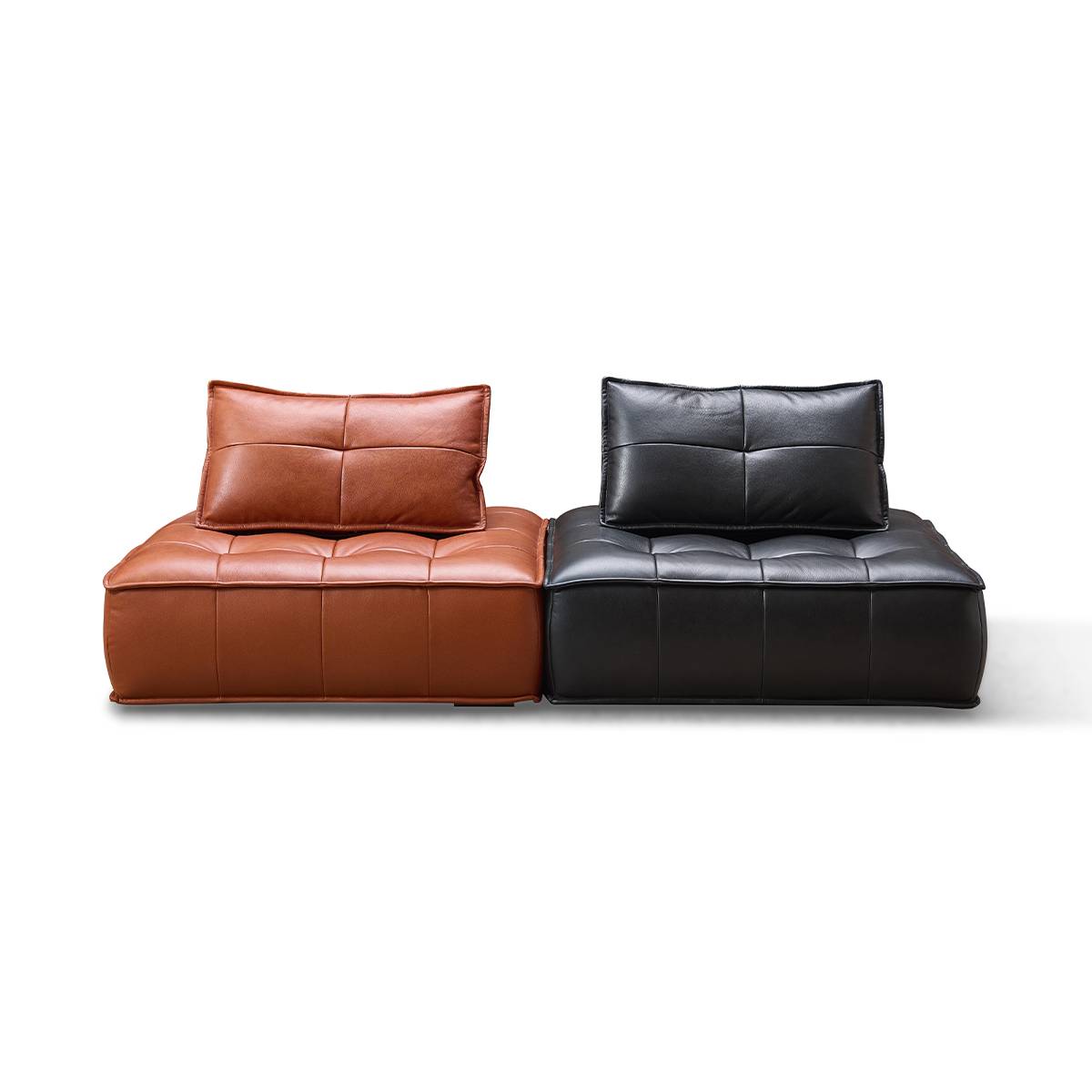 Front view of brown and black tufted leather single-seater sofas