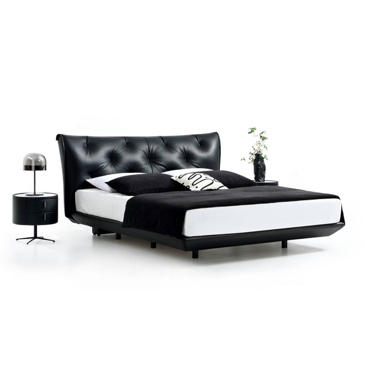 Side angle view of the black leather bed frame and legs