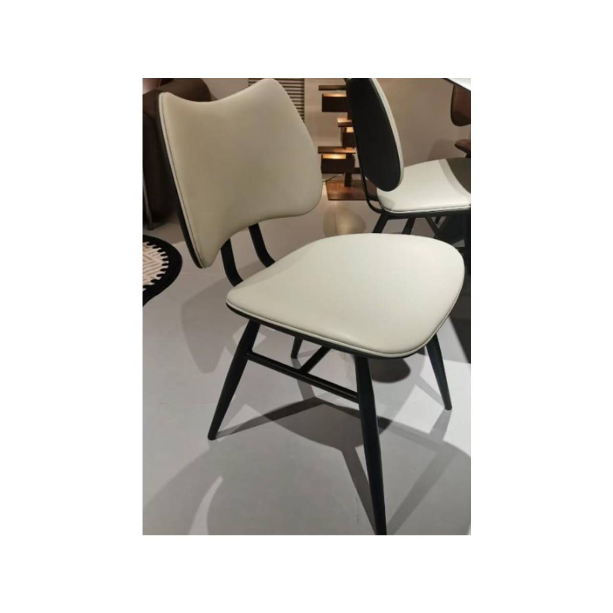 Close-up of beige dining chair showing seat and backrest details