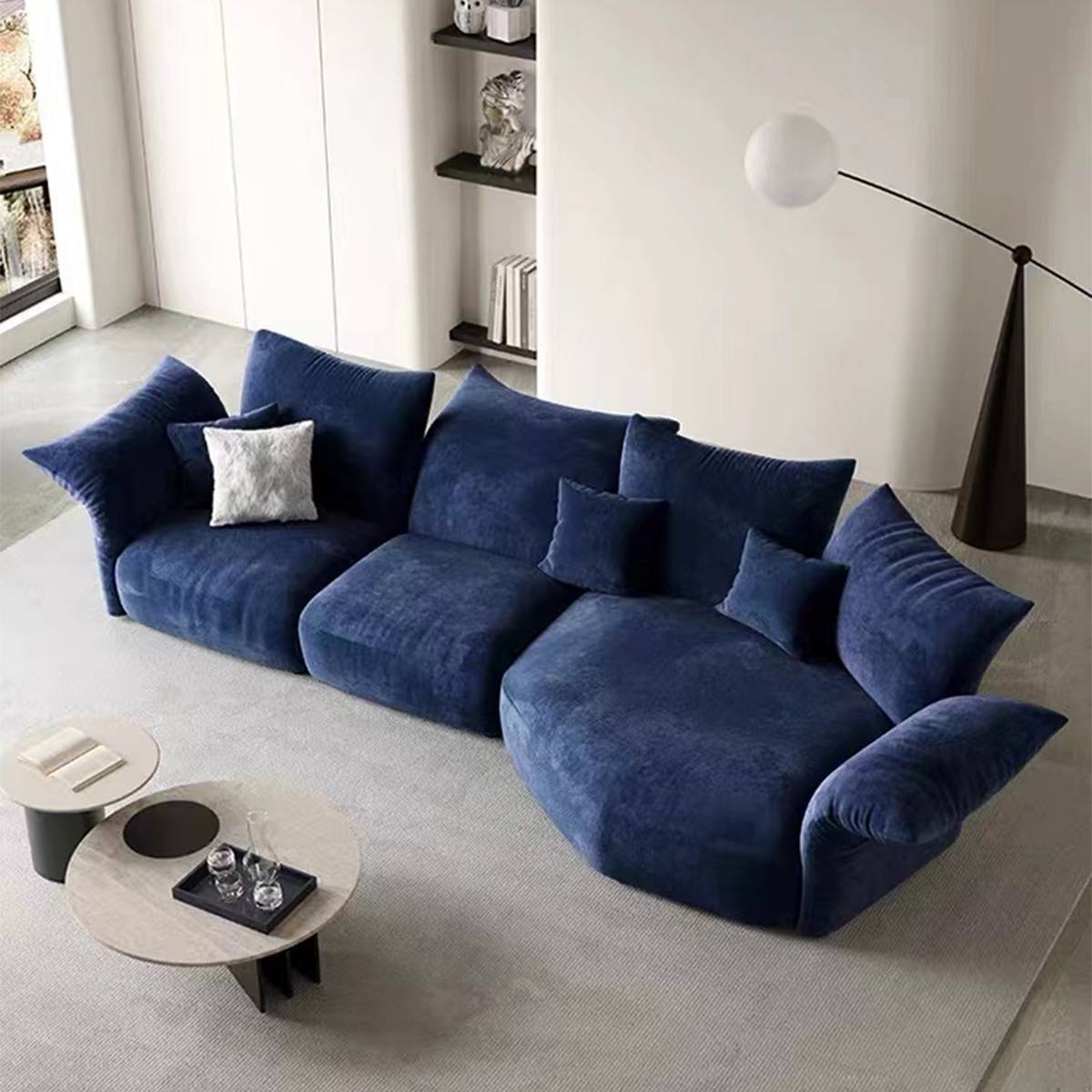 Blue petal-shaped modular sofa in a living room setting