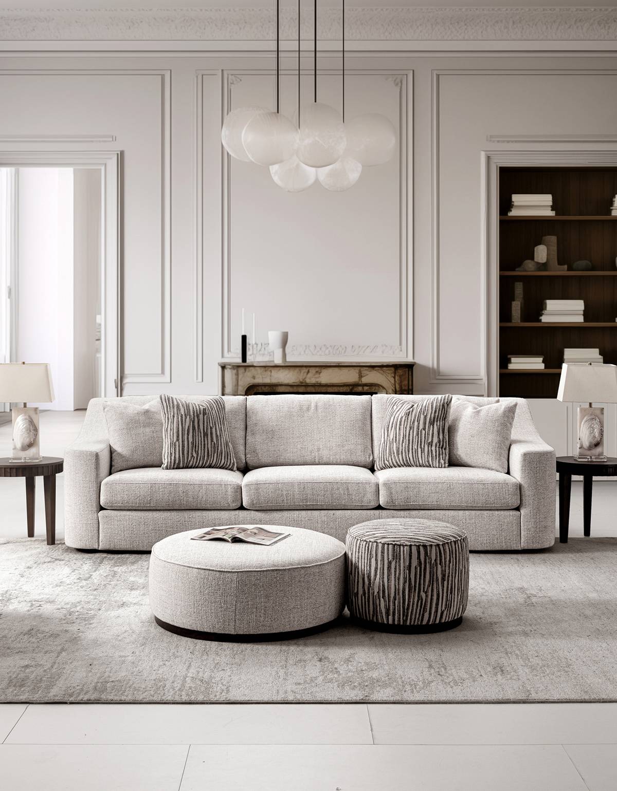 Full living room setup featuring the sofa, ottomans, and side tables