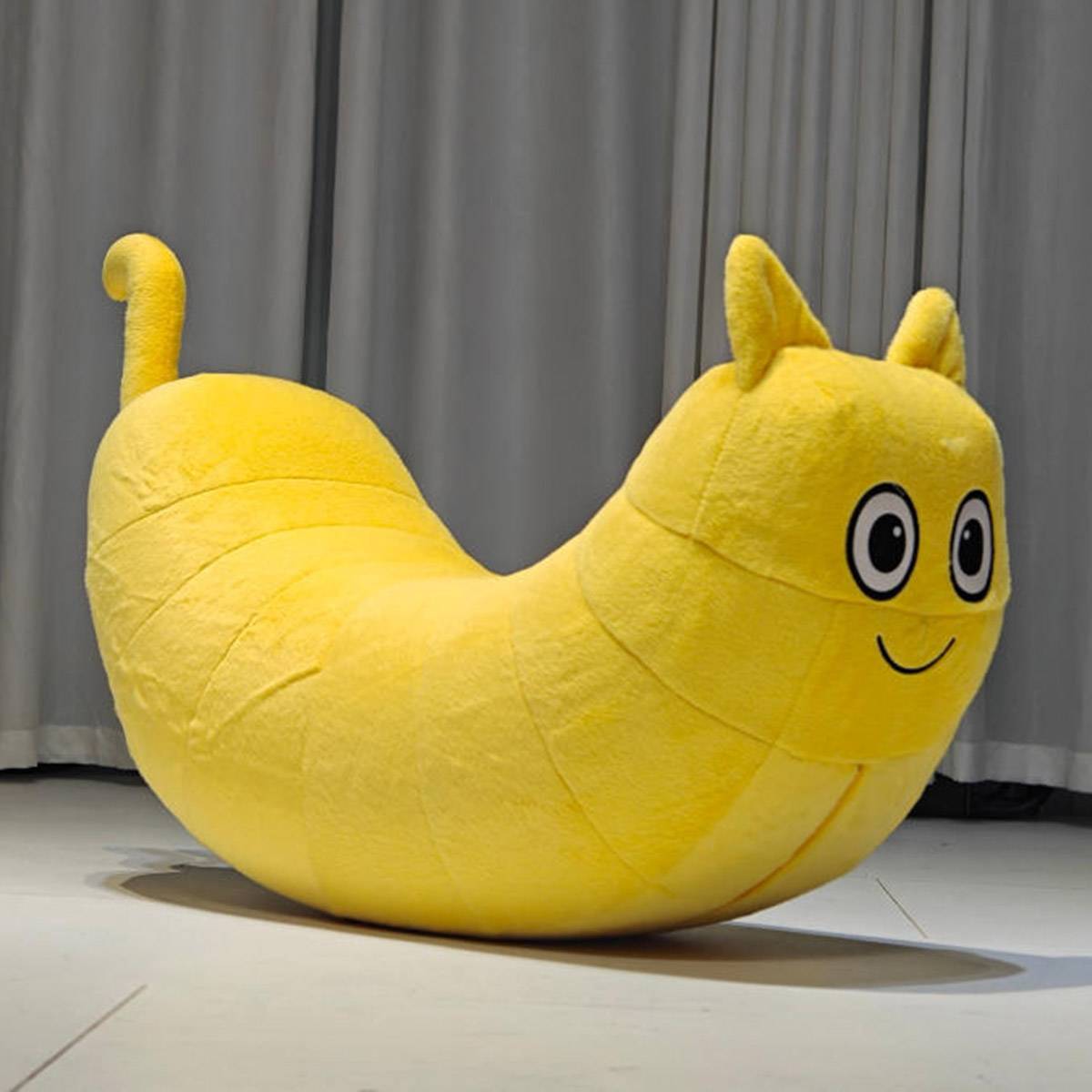Close up of the yellow caterpillar chair face