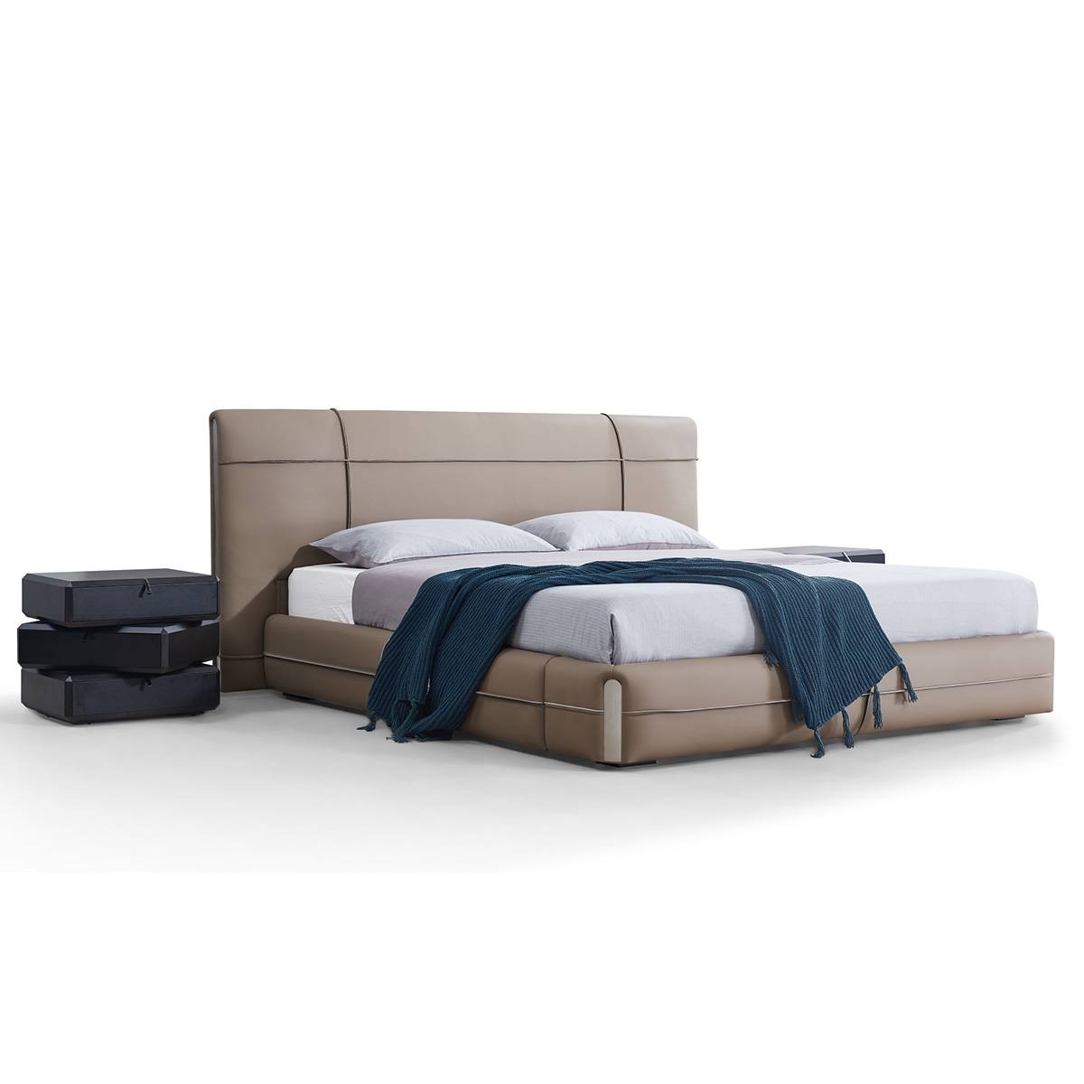 Full view of the taupe leather bed with blue throw blanket
