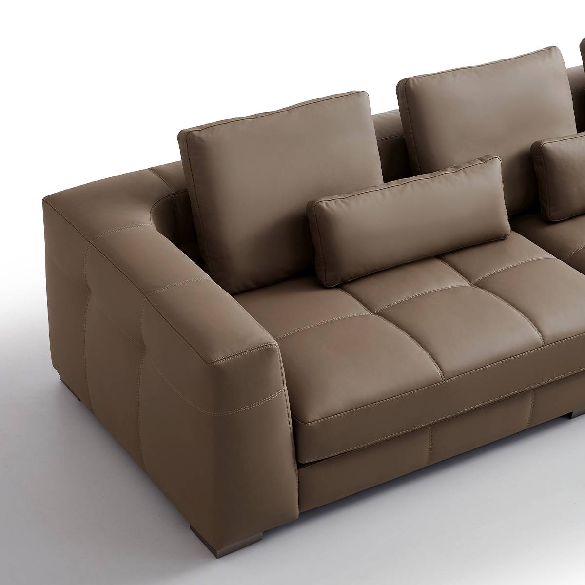 Close-up view of the sofa armrest and seat cushion stitching
