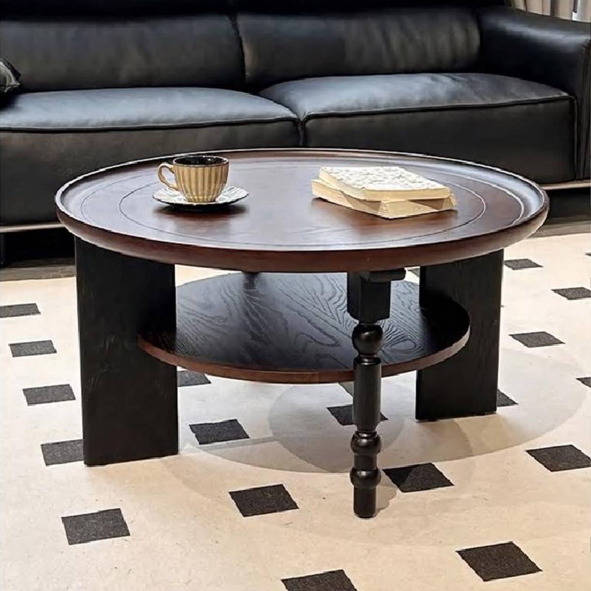 Front view of the coffee table displaying the lower shelf and turned leg details.