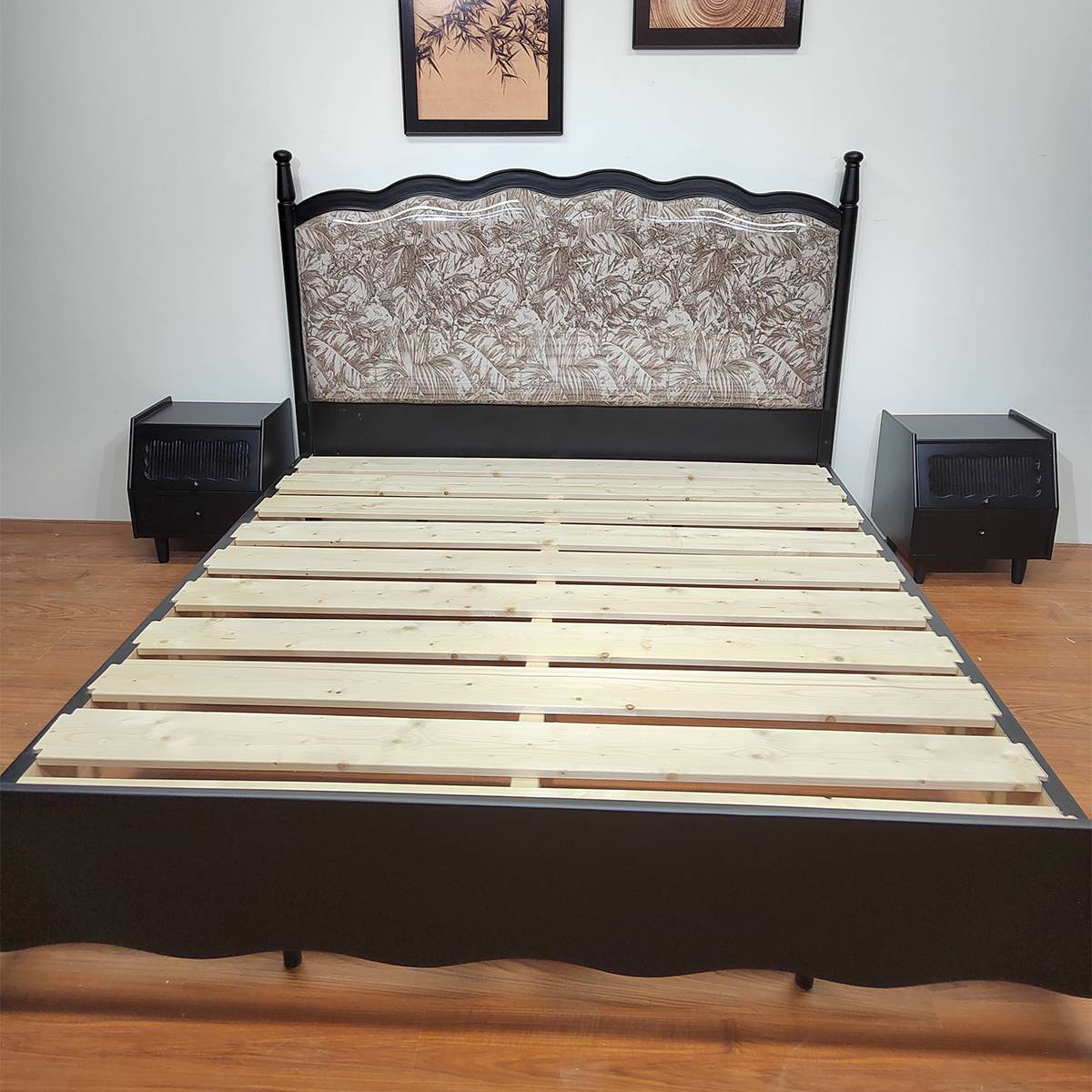 Close-up of the bed frame showing the wooden slat base and headboard detail